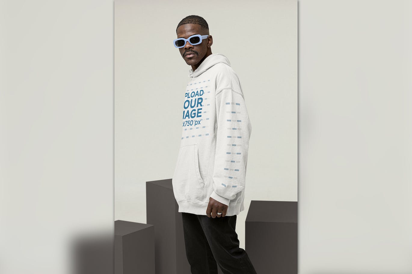 连帽衫设计展示酷男模特样机图 Mockup of a Cool Man Wearing a Hoodie 样机素材 第1张